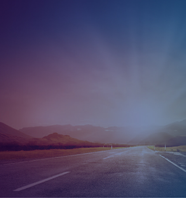 Sun rising over road