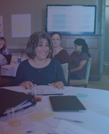 Counselor laughing at professional conference