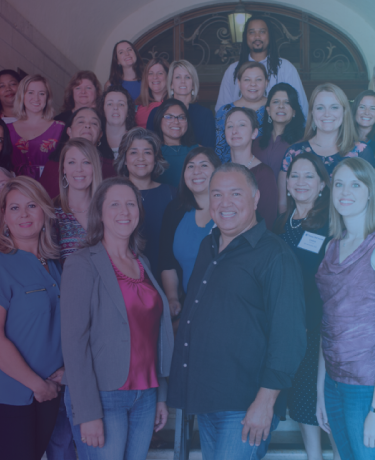 Texas OnCourse leader fellow team and staff - thirty people in professional dress